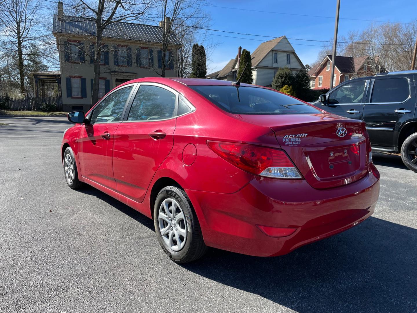 2014 Red Hyundai Accent GLS 4-Door (KMHCT4AE5E4) with an 1.6L L4 DOHC 16V engine, located at 101 N. Main Street, Muncy, PA, 17756, (570) 546-5462, 41.207691, -76.785942 - Photo#2